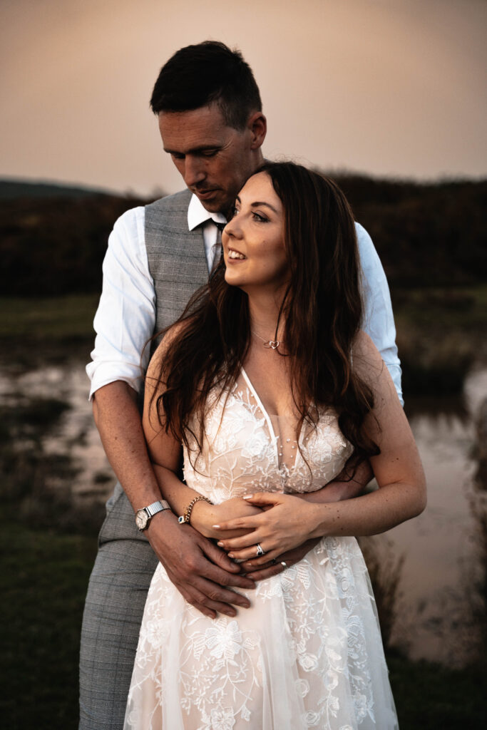The bride and groom having portraits together during golden hour which was scheduled into their wedding day timeline