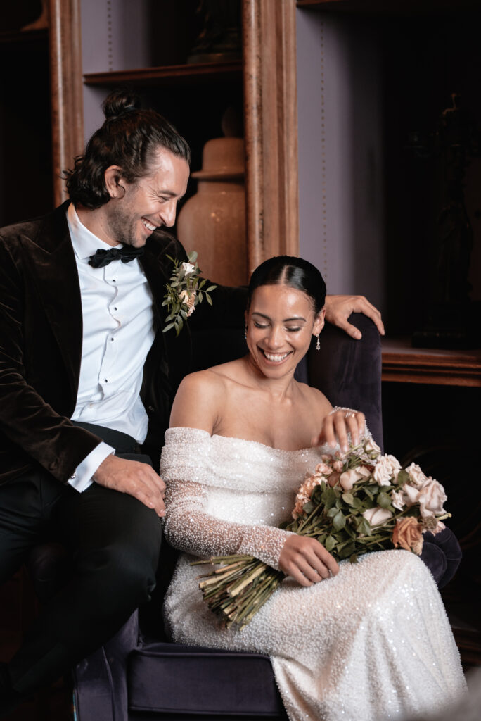The bride and groom inside of their wedding venue in Somerset sharing an intimate moment together