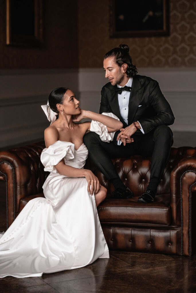 The bride and groom inside of their wedding venue in Somerset sharing an intimate moment together