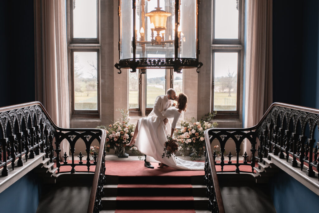 The bride and groom inside of their wedding venue in Somerset during a portrait session